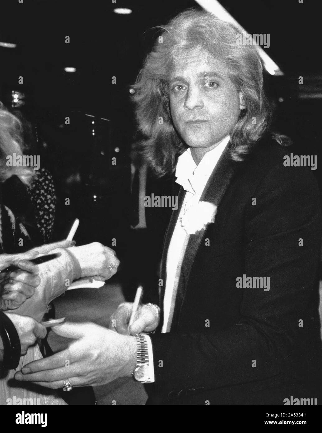 Eddie Money signing autographs for fans while attending the 1989