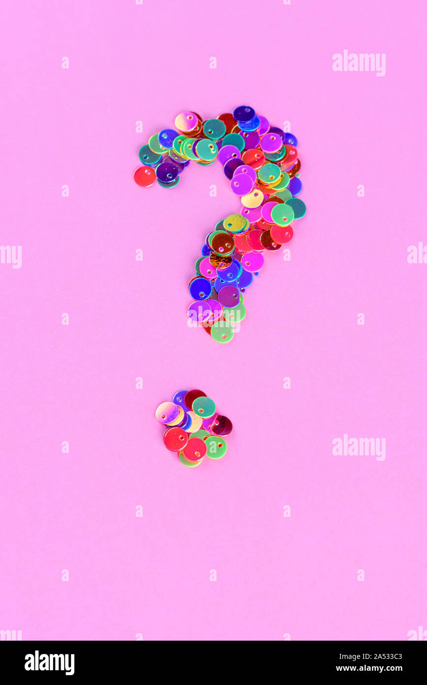 Holographic glitter question mark from sequins.Copy space Stock Photo