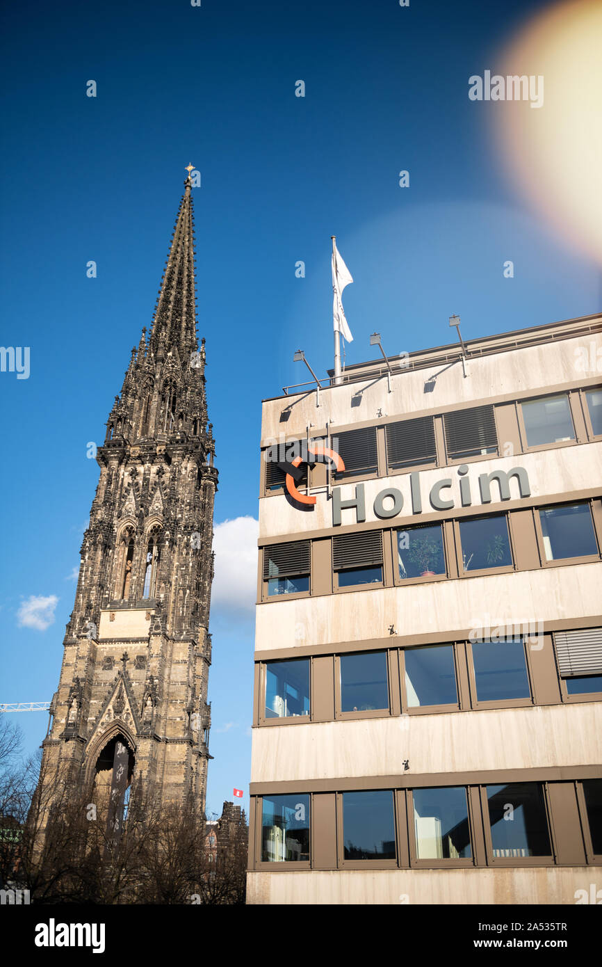 Hamburg Germany Mar 18 St Nikolai Memorial And Logotype Insignia On The Headquarter Of Holcim Swiss Based Global Building Materials And Aggregates Company Stock Photo Alamy