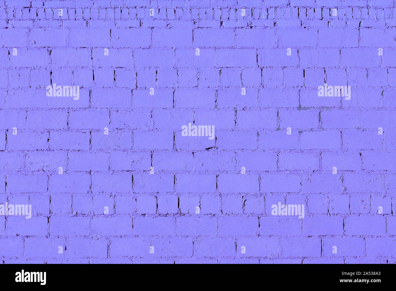 violet plaster rough brick wall texture under direct sunlight Stock Photo