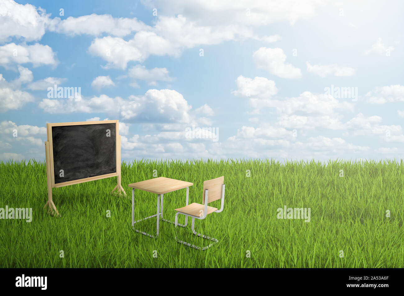 3d rendering of school desk, chair and board on green grass and blue sky background Stock Photo