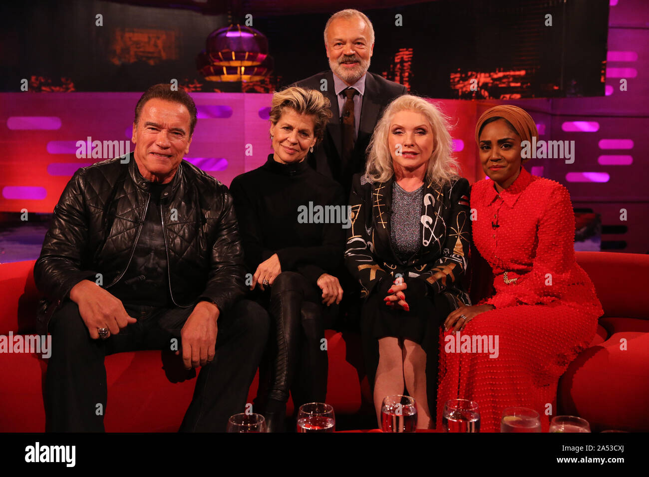 Host Graham Norton with (seated left to right) Arnold Schwarzenegger, Linda Hamilton, Debbie Harry and Nadiya Hussain, during the filming for the Graham Norton Show at BBC Studioworks 6 Television Centre, Wood Lane, London, to be aired on BBC One on Friday evening. Stock Photo