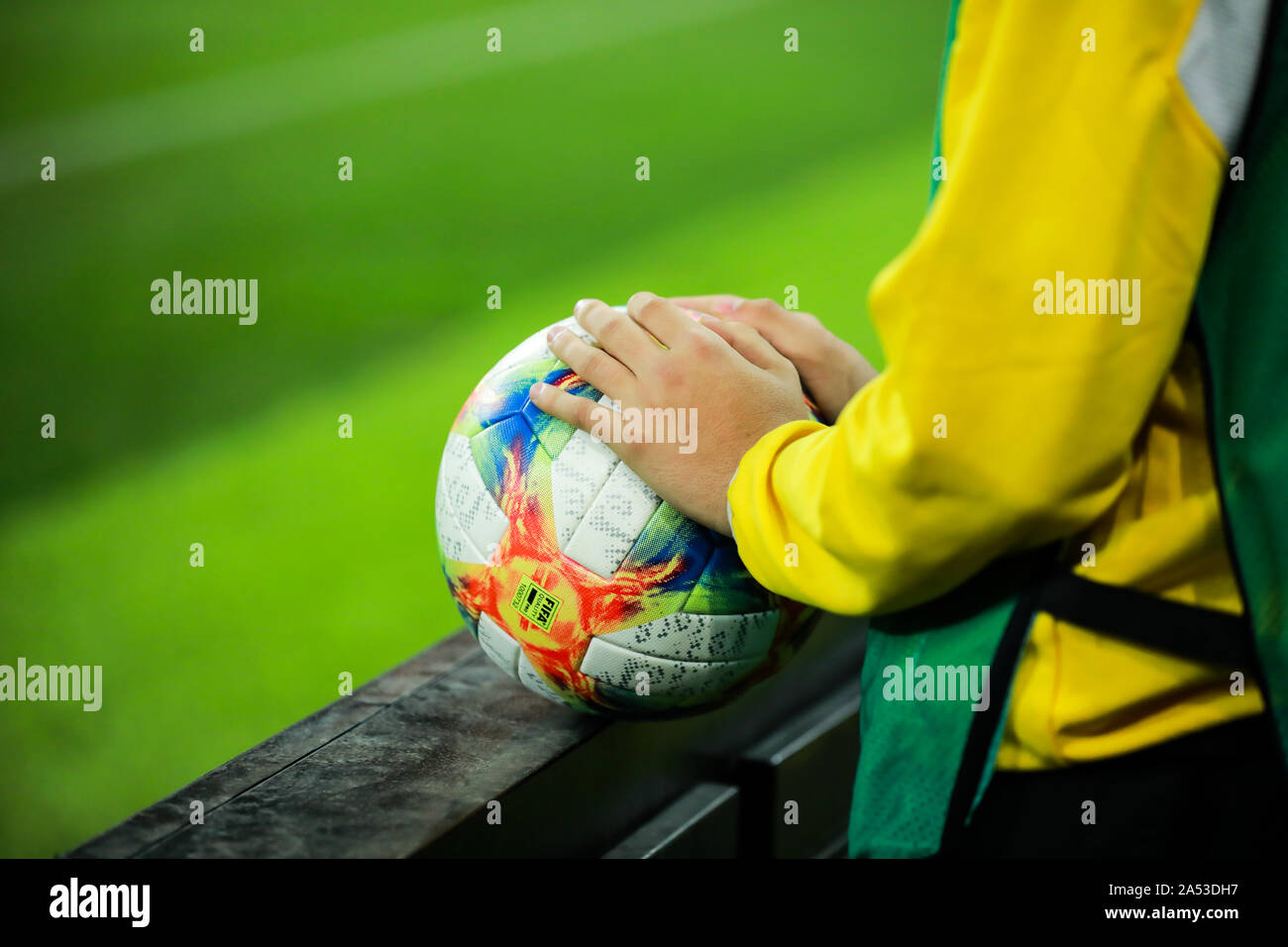 Bucharest, Romania - October 15, 2019: Details with the hands of a boy on an Adidas Conext 19 European qualifiers official soccer match ball on Arena Stock Photo