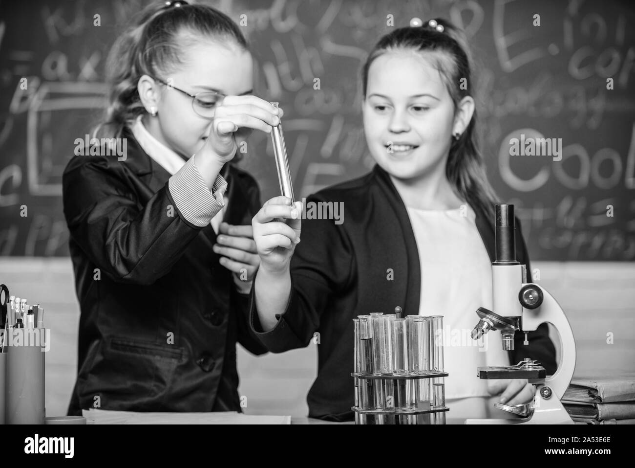 science is we. Little girls scientist with microscope. Biology lab