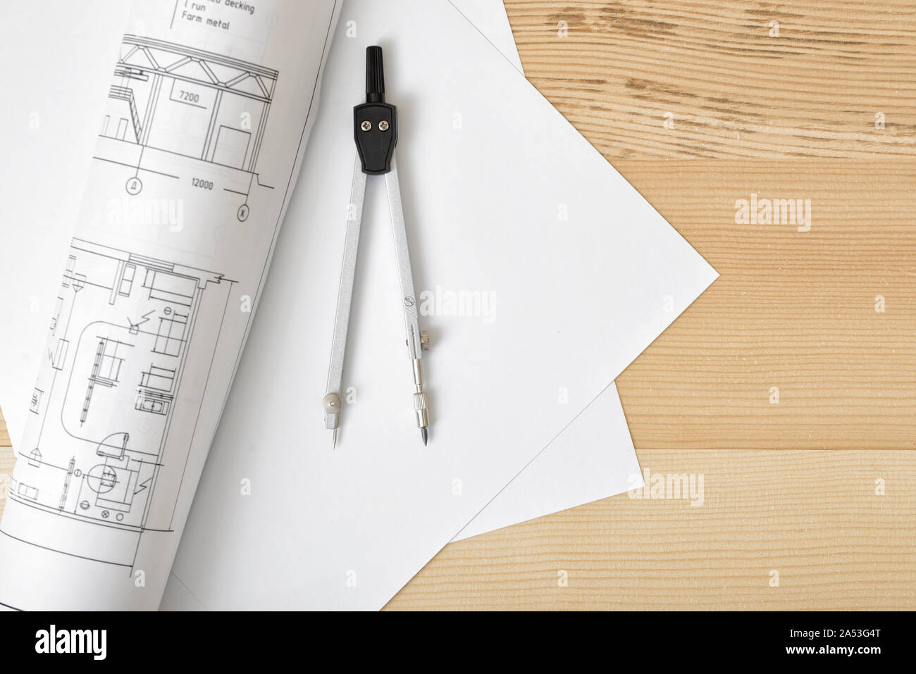 Compass on white paper in top view with copy space Stock Photo - Alamy