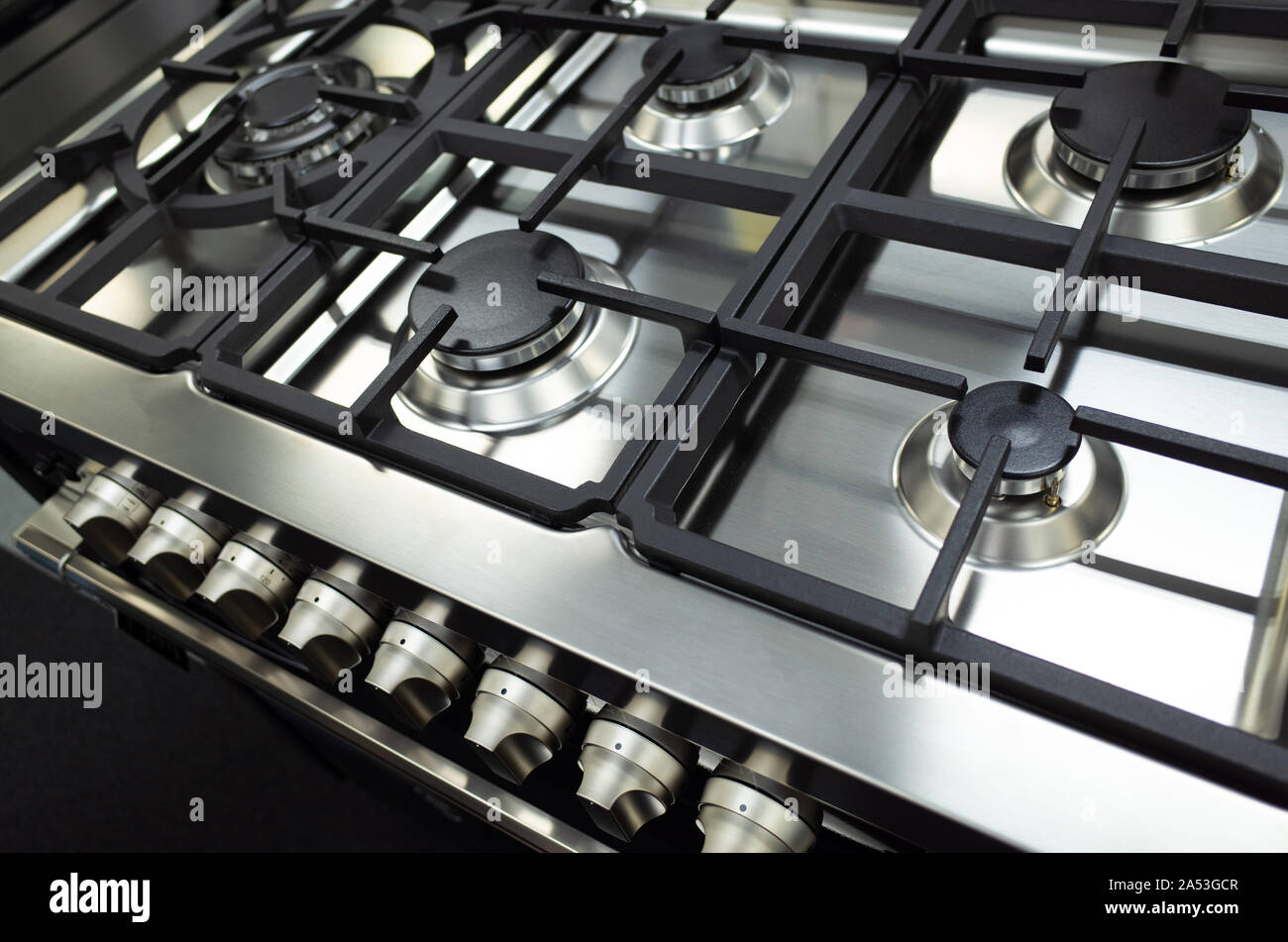 Close up of a brand new and clean stainless steel stove top/hop or a gas cooktop. Stock Photo