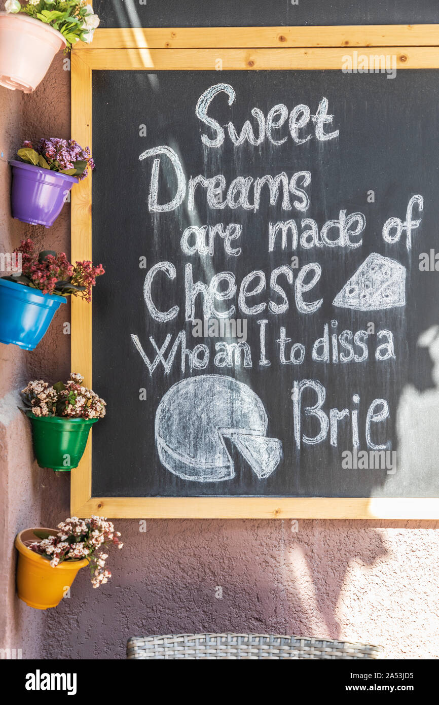 Armenia. Yerevan. August 16, 2018. Flower pots and chalk board at a