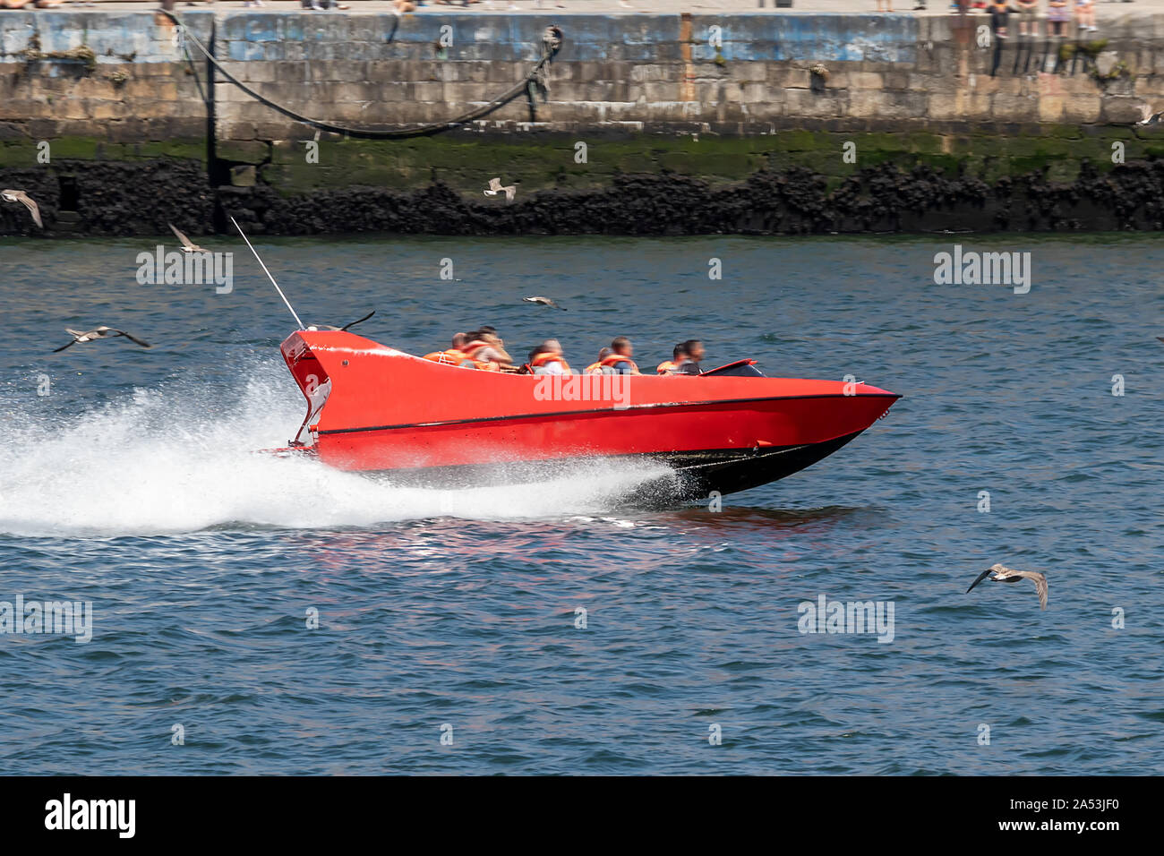 Jet Boat in Porto, Portugal. High speed red boat over Douro river Stock Photo