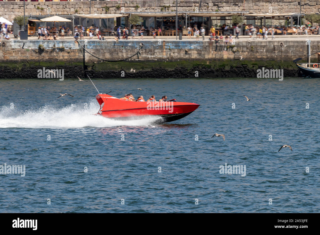 Jet Boat in Porto, Portugal. High speed red boat over Douro river Stock Photo