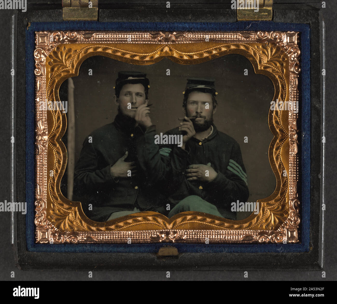 Two unidentified soldiers in Union uniforms holding cigars in each ...