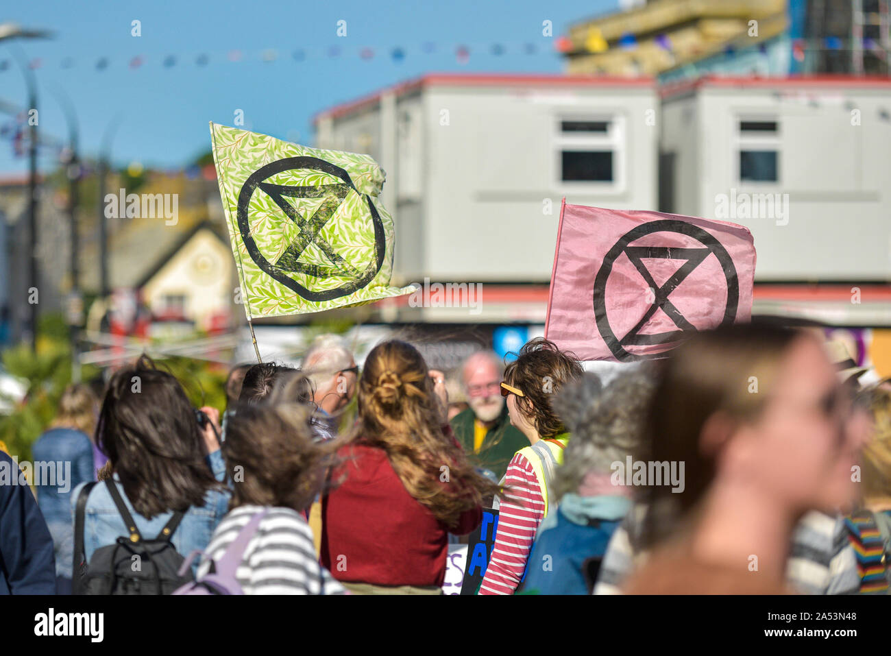 Extinction Rebellion flags flown at a climate change protest in Truro City City in Cornwall. Stock Photo