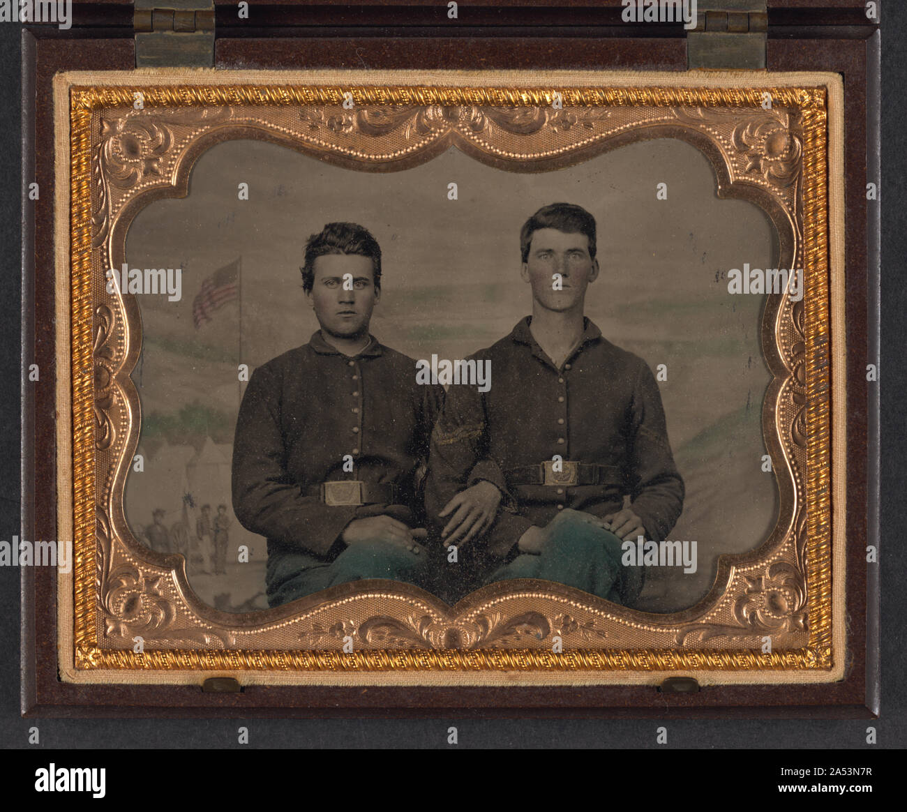 Two unidentified soldiers in Union uniforms in front of painted ...