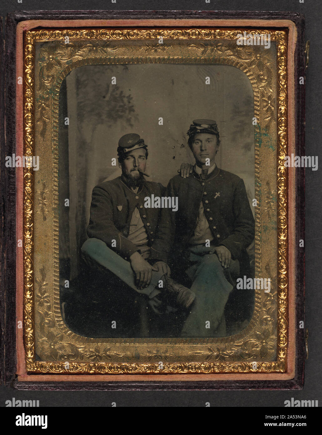 Two unidentified soldiers in Union uniforms in front of painted ...