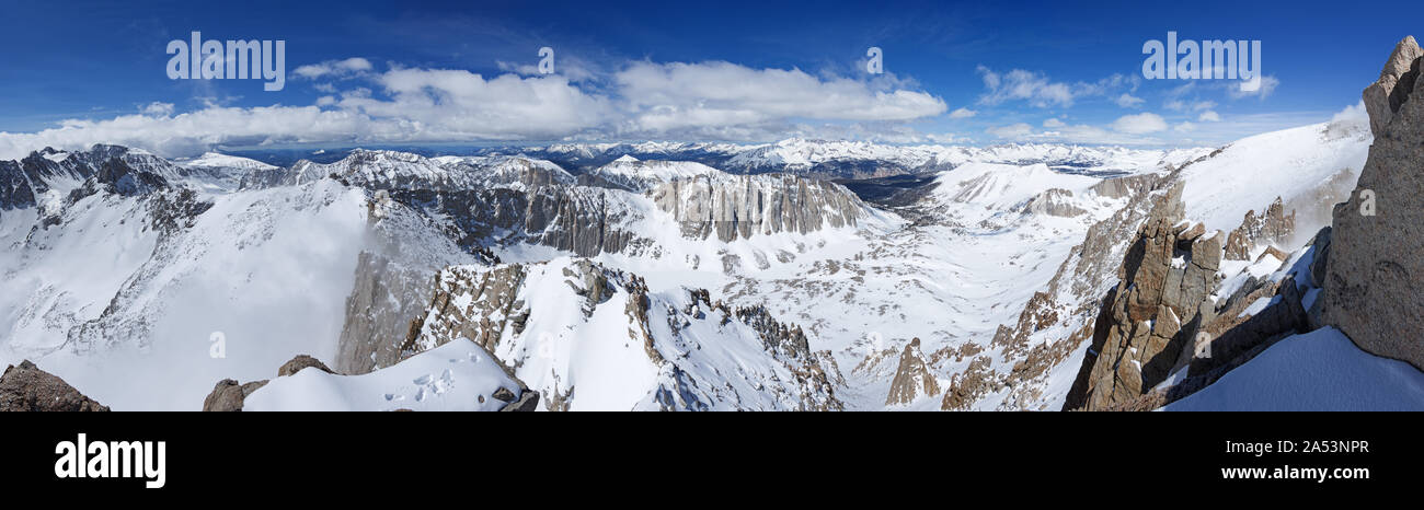 panorama from near the summit of Mount Muir in snowy conditions from Mount Langley through the west to Mount Whitney Stock Photo
