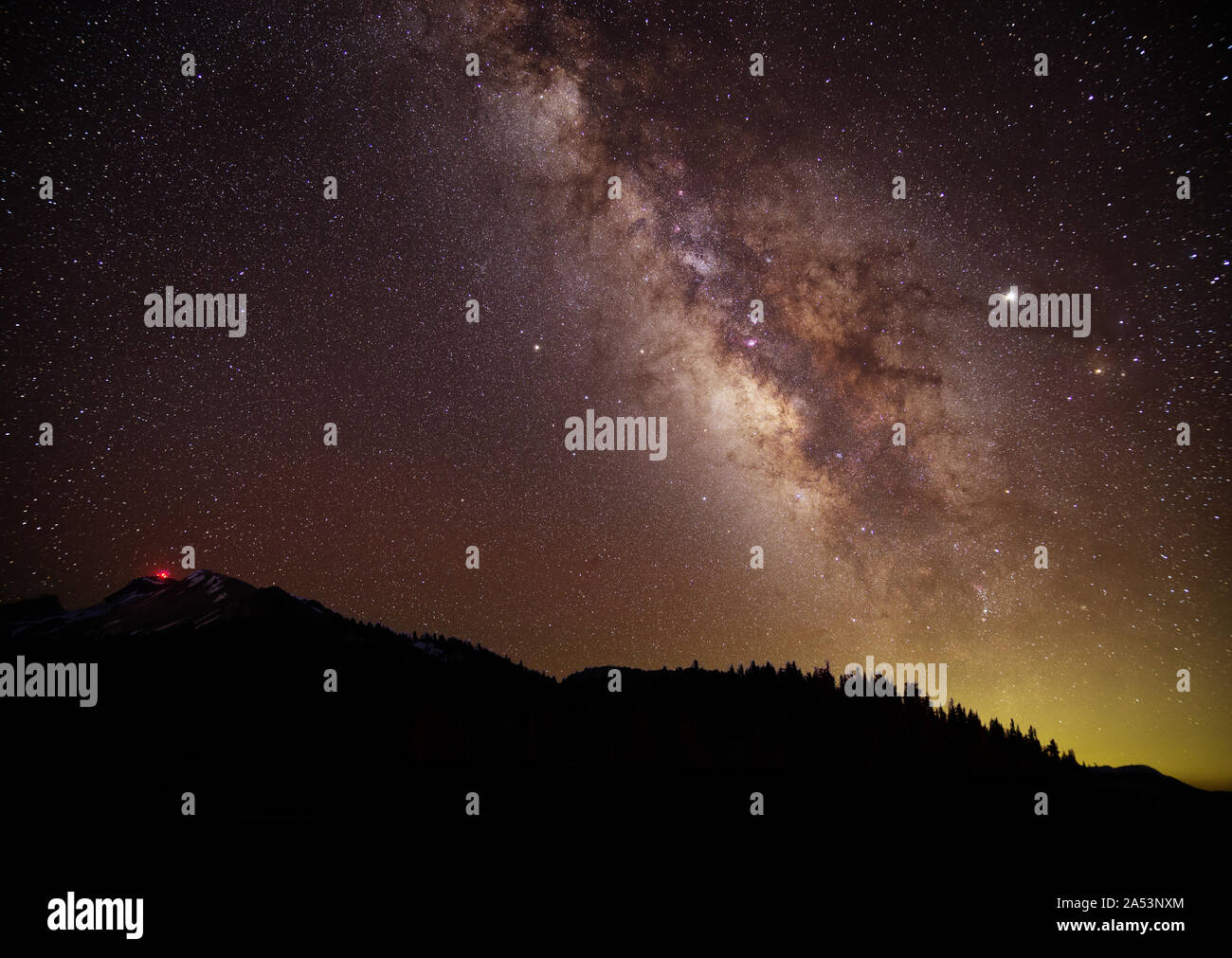 the milky way over Mammoth Mountain in California Stock Photo