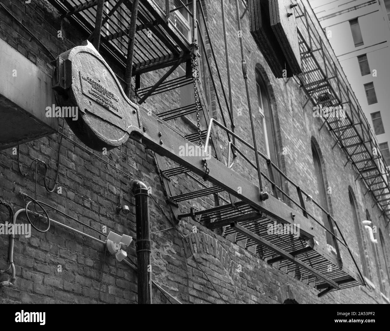 old fire escape and counterweight Stock Photo Alamy