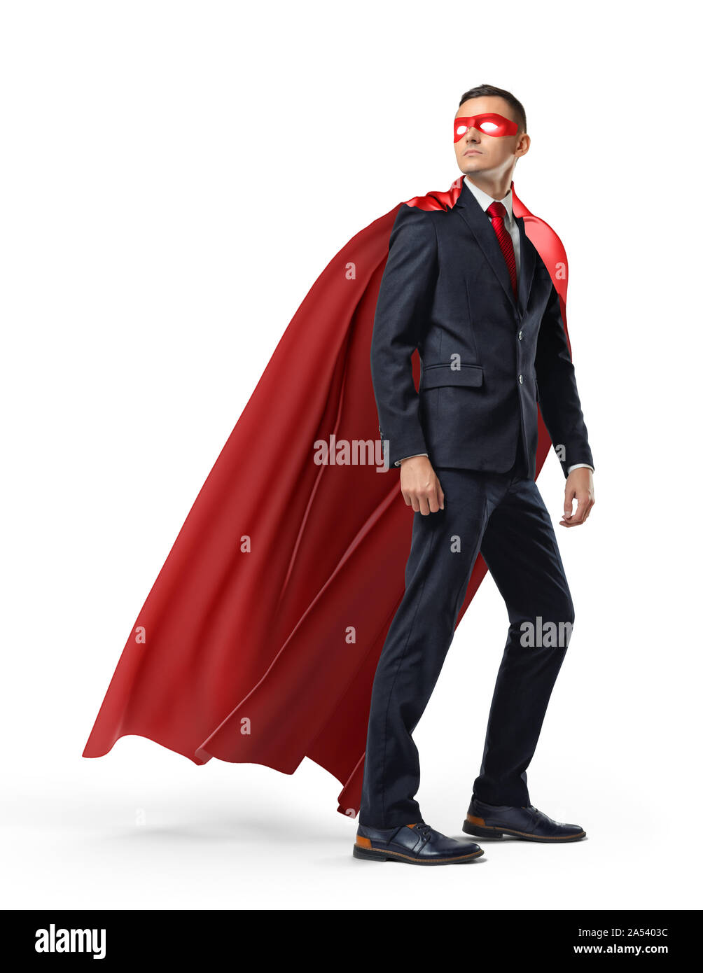 A businessman in a hero red cape and a mask in front view looking in the distance over his shoulder on white background. Stock Photo