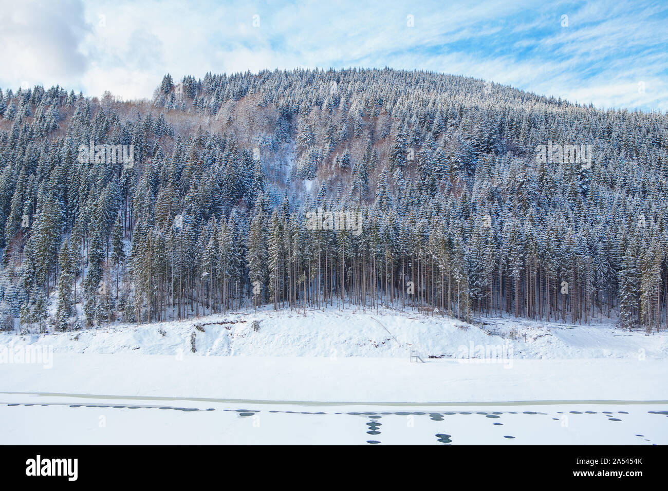 winter scenery with coniferous forest and frozen lake Stock Photo - Alamy