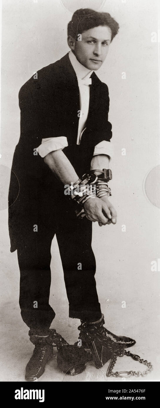 Magician and illusionist Harry Houdini in chains and handcuffs Stock Photo  - Alamy