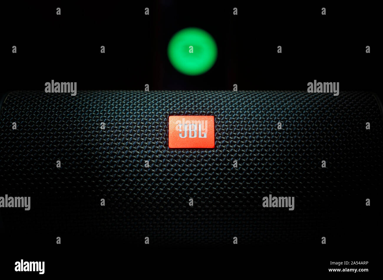 Dramatic close up shot of a JBL Logo with blurred Spotify Music App Logo. JBL  Flip 4 Bluetooth portable speaker Stock Photo - Alamy