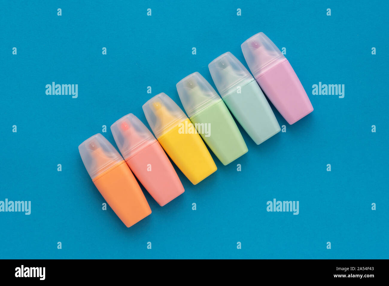 Highlighters set on colored blue background. Collection of markers