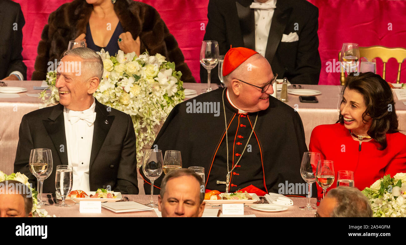 New York, NY - October 17, 2019: General Jim Mattis, Timothy Cardinal Dolan, Mary Ann Tighe attend 74th Annual Alfred E. Smith Memorial Foundation Dinner at Hilton Midtown Stock Photo