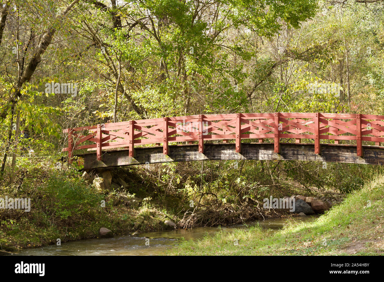 Woodland with bridge over river in a rural setting hi-res stock ...