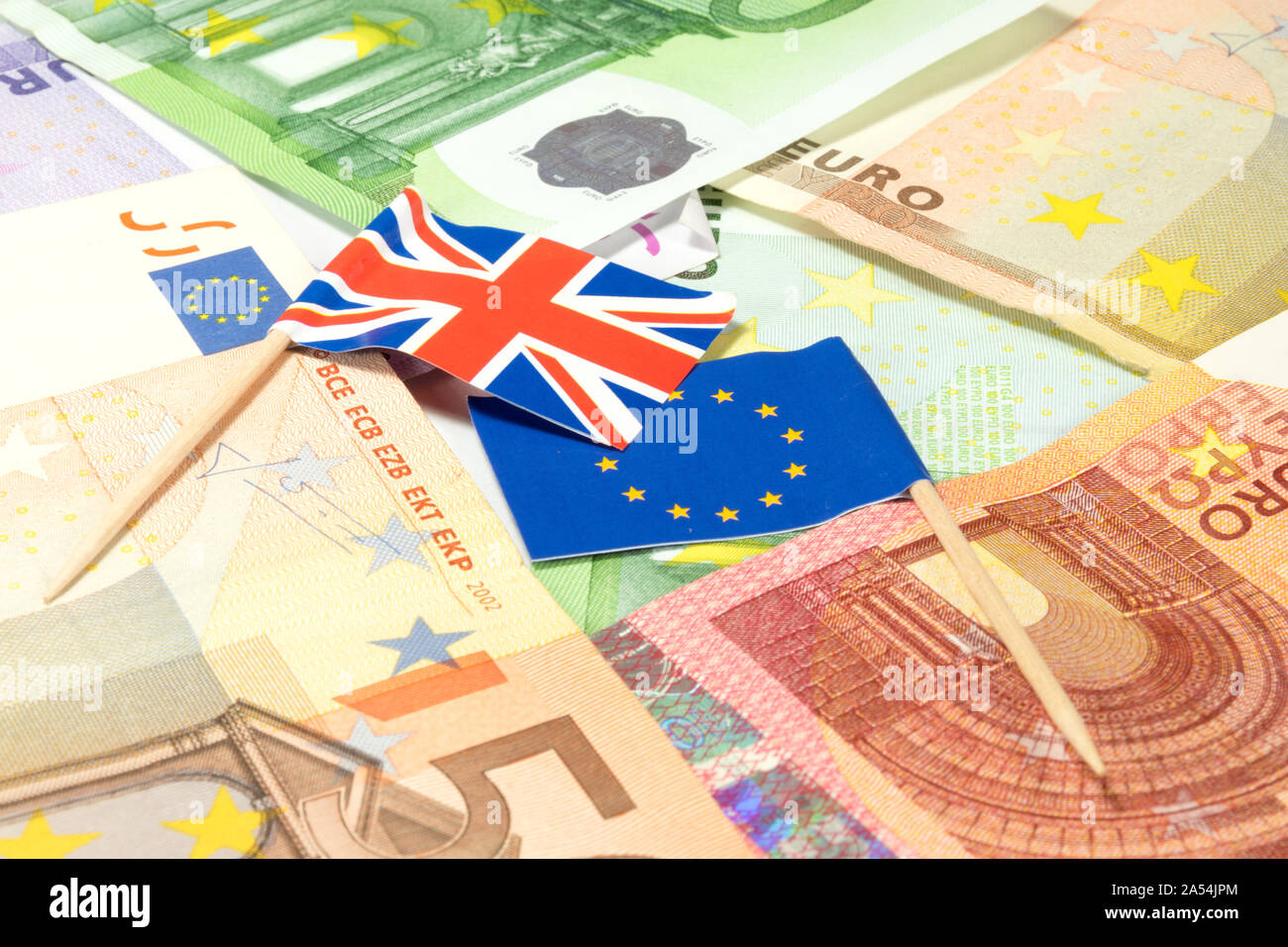 Euro bills and flags of EU and Great Britain Stock Photo