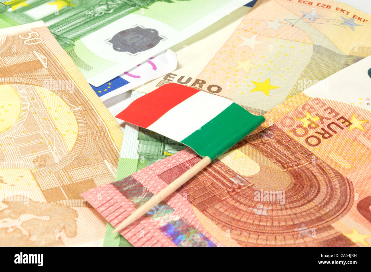 Many euro bills and flag of Italy Stock Photo