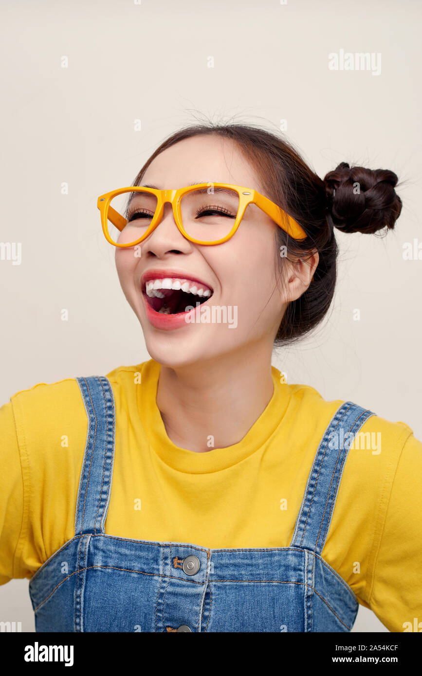 Close up beautiful young Asian woman laugh out loud with two hair-buns Stock Photo