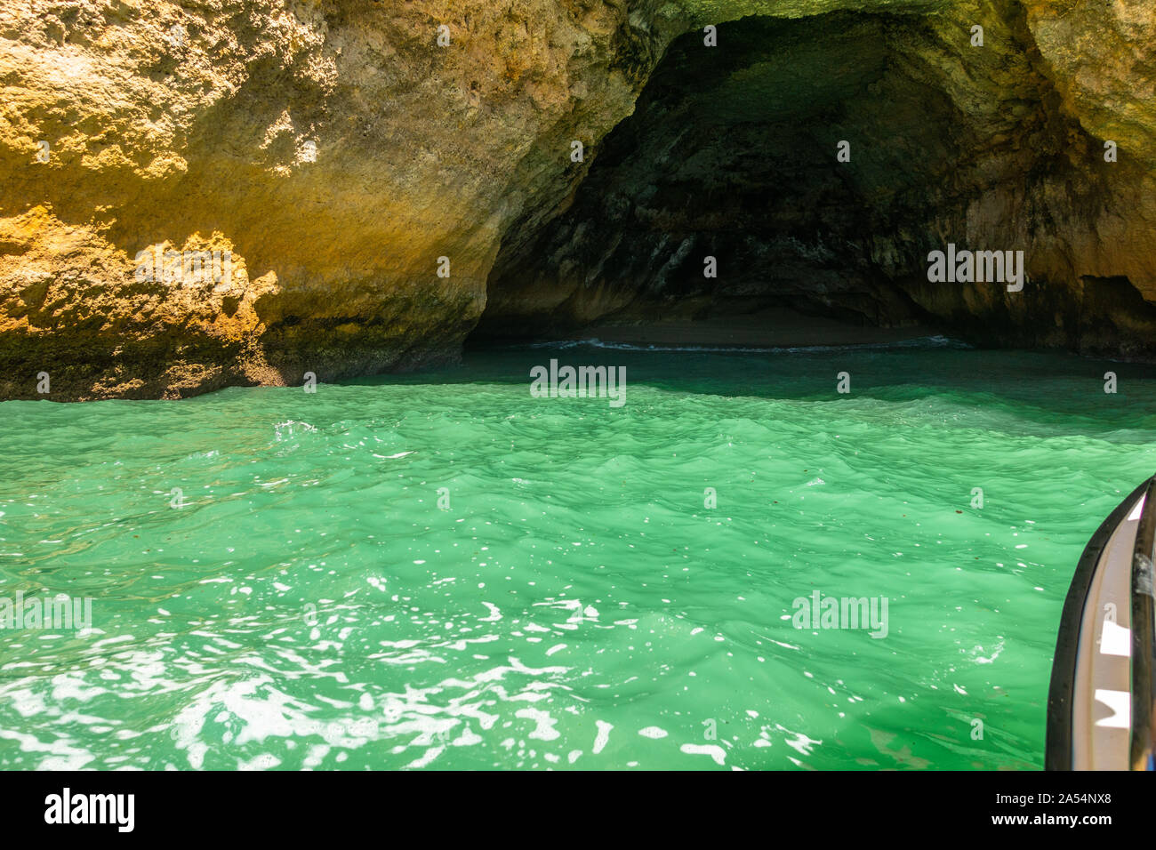 Boat tour visiting the caves along Algarve coastline near the famous Benagil cave, Portugal Stock Photo