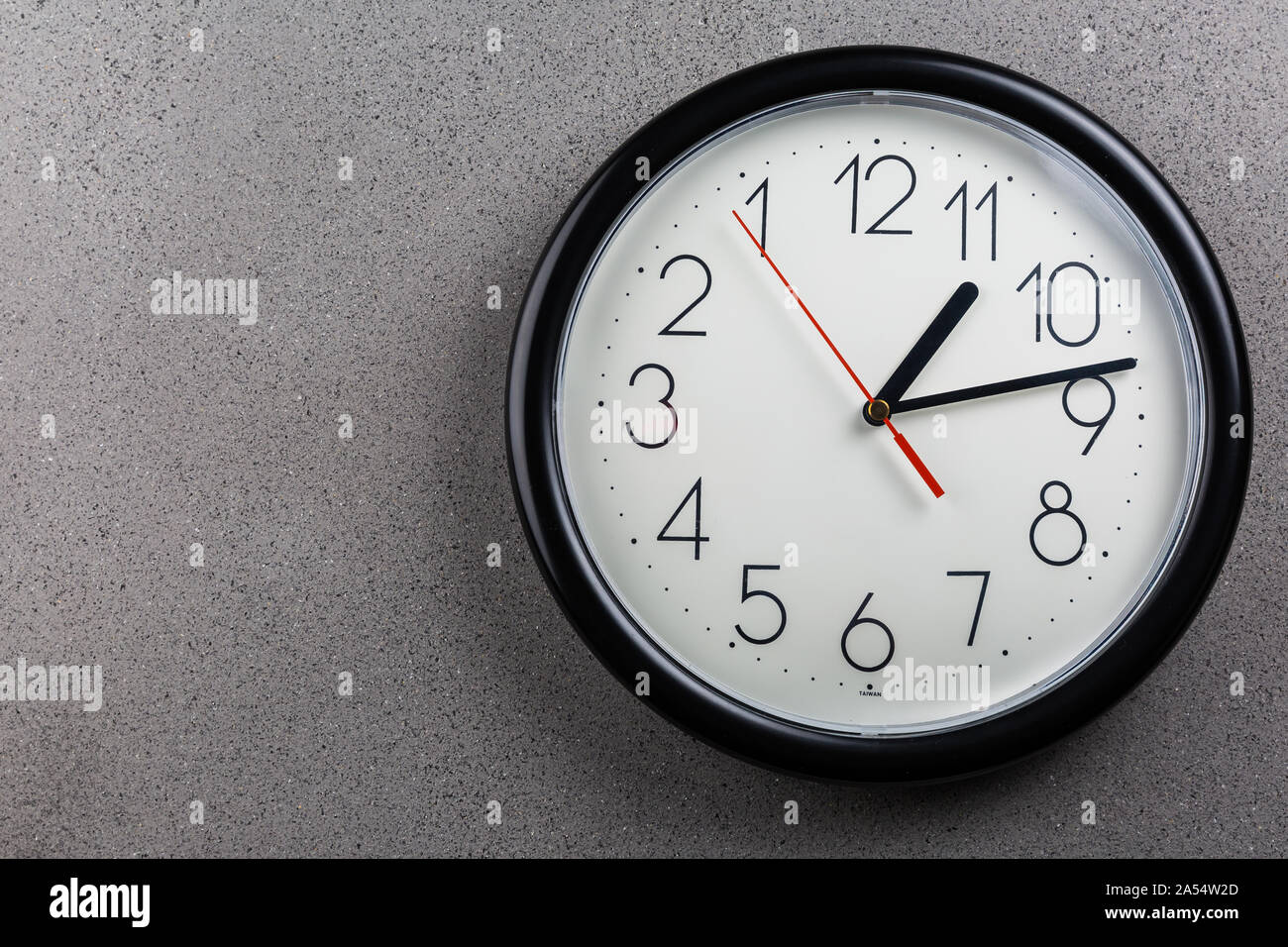 Turn back time concept of turning clock backwards Stock Photo Alamy