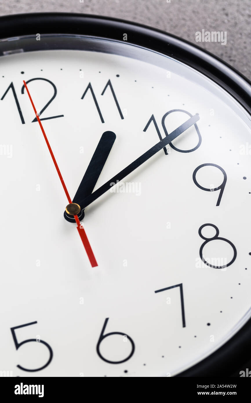 Turn back time concept of turning clock backwards Stock Photo Alamy