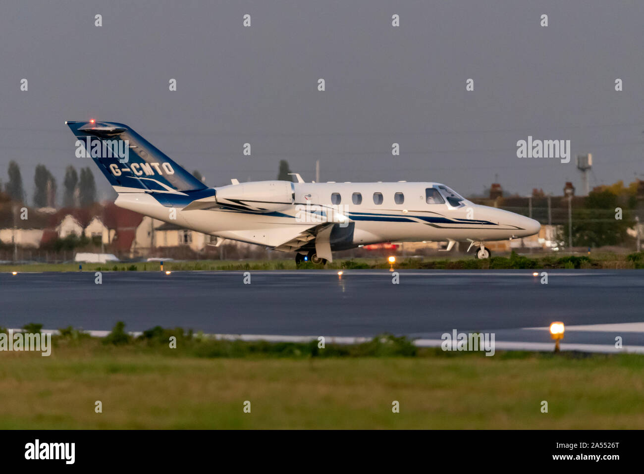 Golconda Aircraft Leasing Cessna 525 Citation M2 bizjet taxiing after landing at London Southend Airport, Southend on Sea, Essex, UK late afternoon Stock Photo
