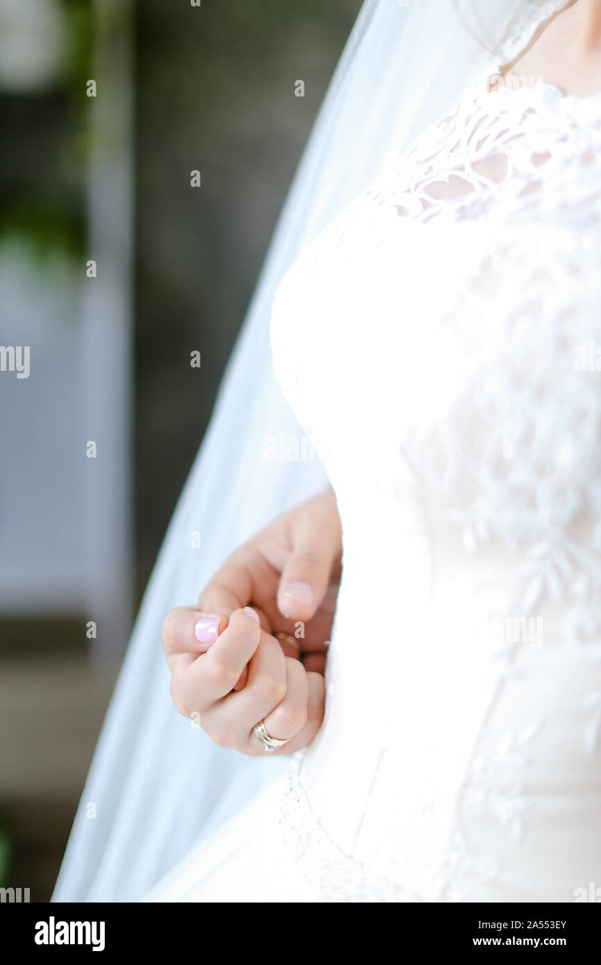 Closeup bridal dress and hand Stock Photo Alamy
