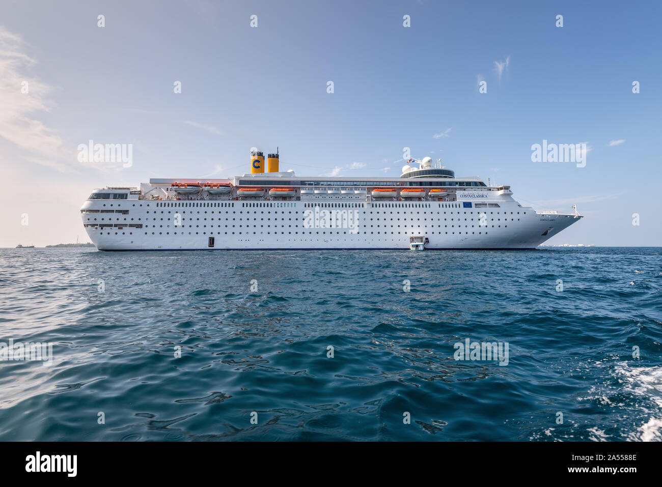 Male, Maldives - November 17, 2017: Costa neoClassica Cruise Ship in the outer harbor of Male island as seen from the boat in Maldives, Indian Ocean. Stock Photo
