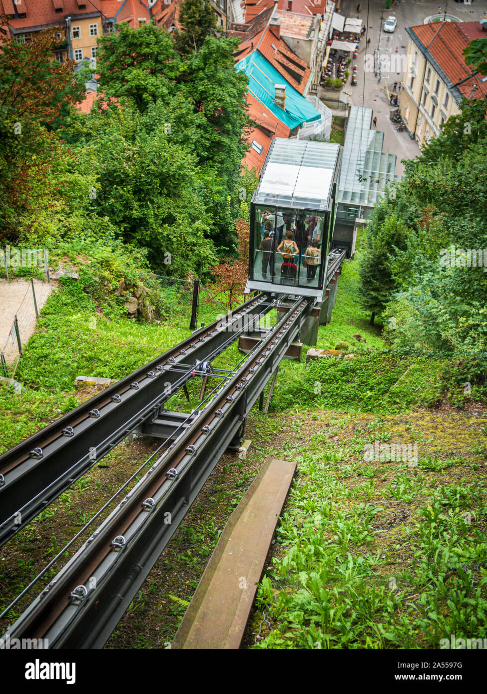 Funicular railway with tourists. Connecting the old town to Ljubljana castle Slovenia Stock Photo