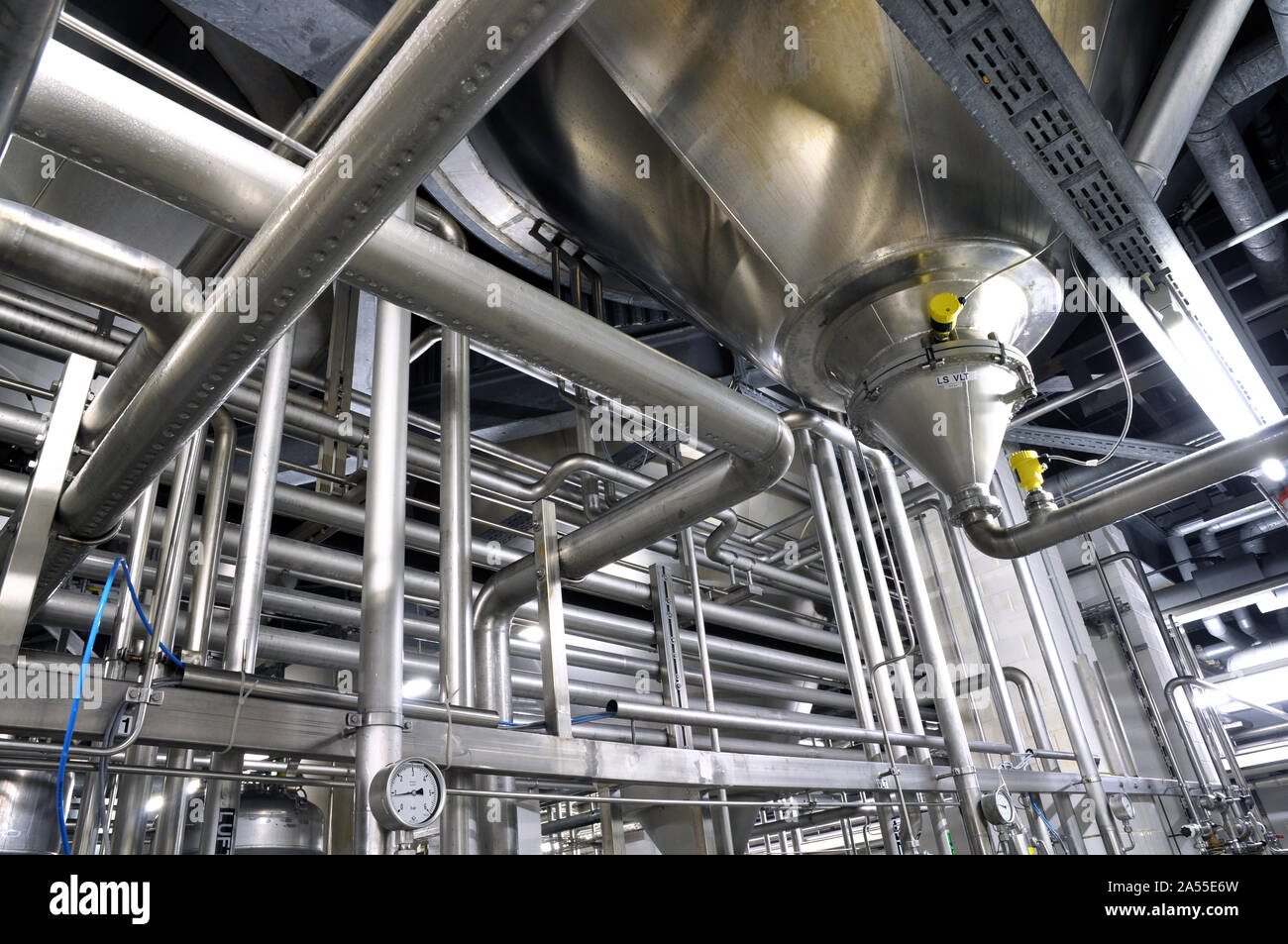 Industrial plant in a modern brewery - technology in a factory building with pipes and fittings Stock Photo