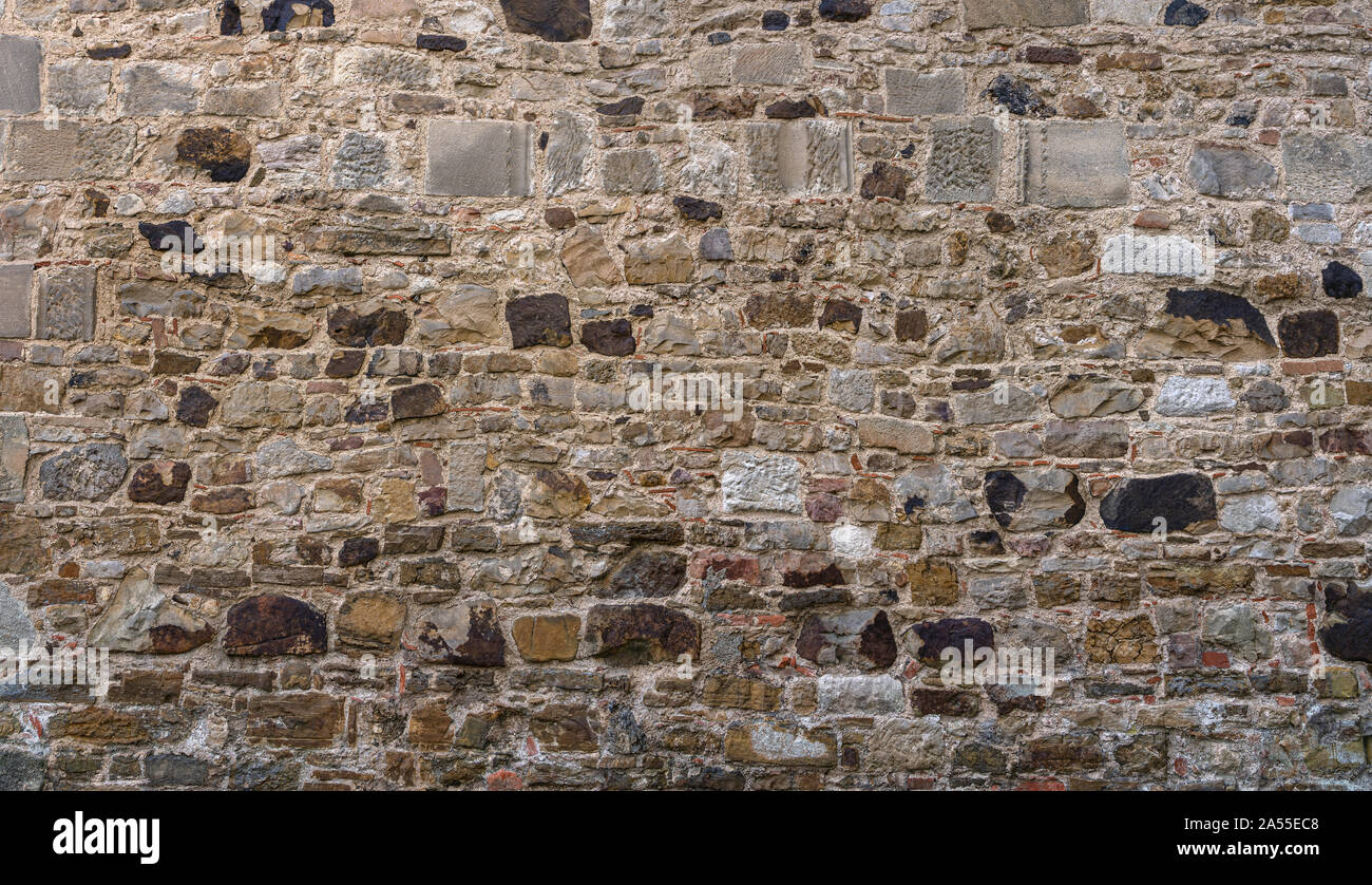 Very old, gray brown stone wall Stock Photo