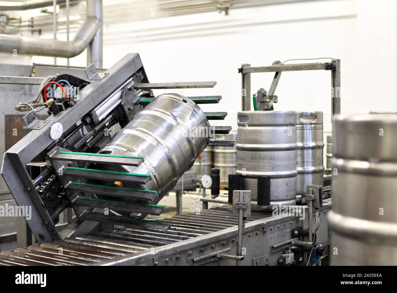 beer barrels in the filling process in a brewery beer production in the modern food industry