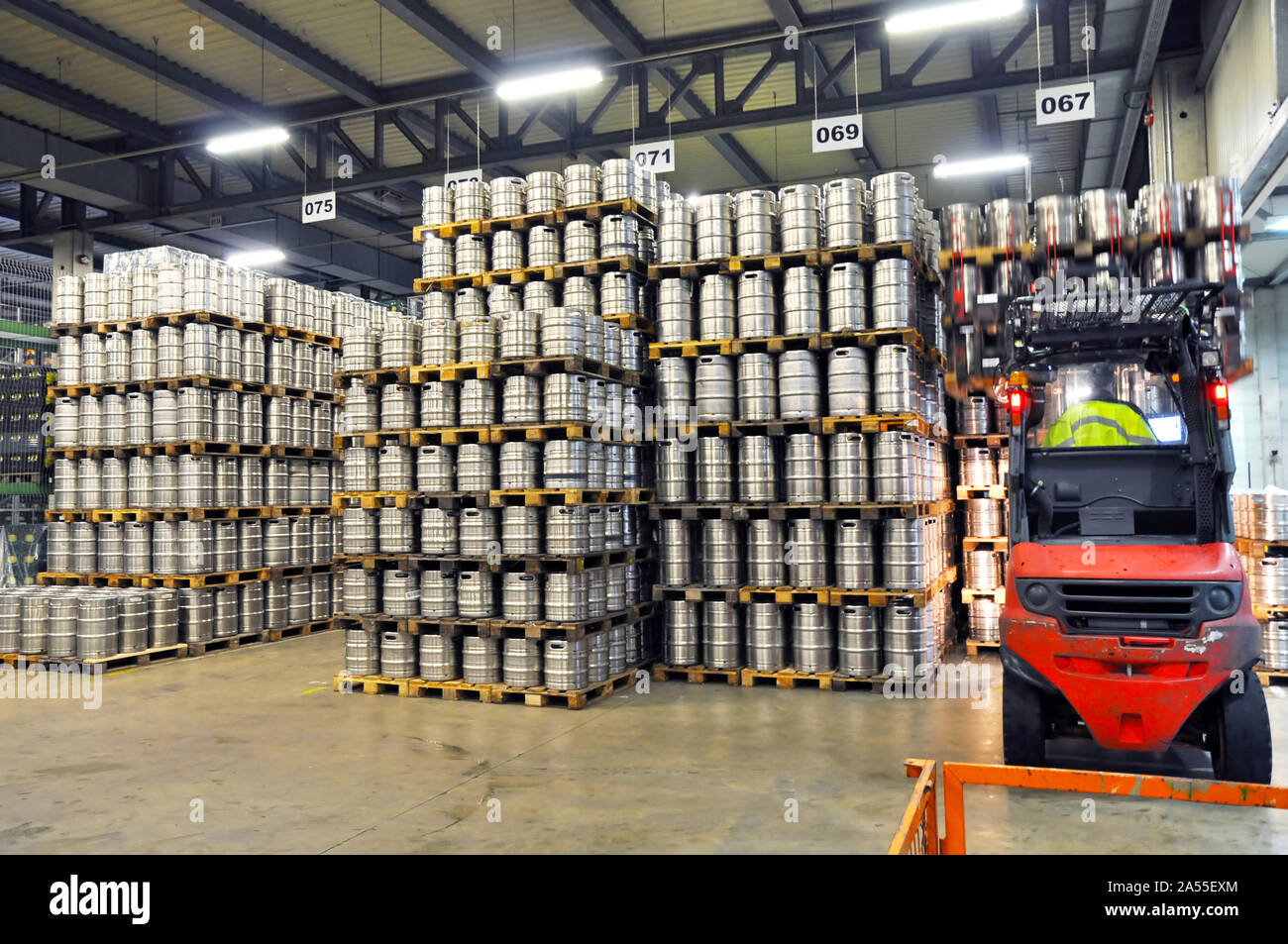 beer barrels in the filling process in a brewery beer production in the modern food industry