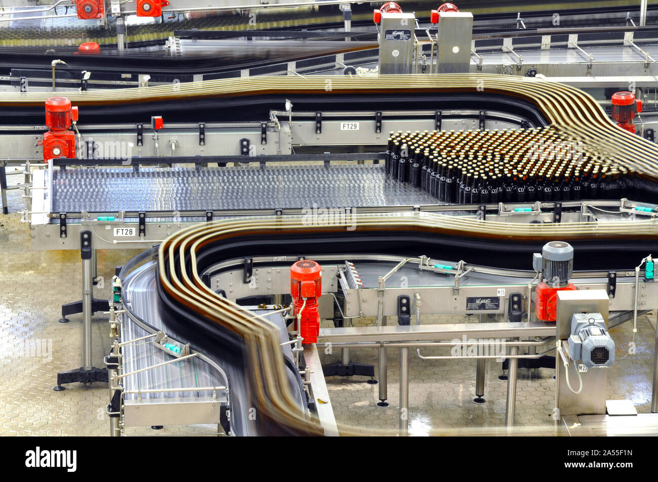 modern factory in the food industry - beer brewery - conveyor belt with beer bottles and machines for production Stock Photo