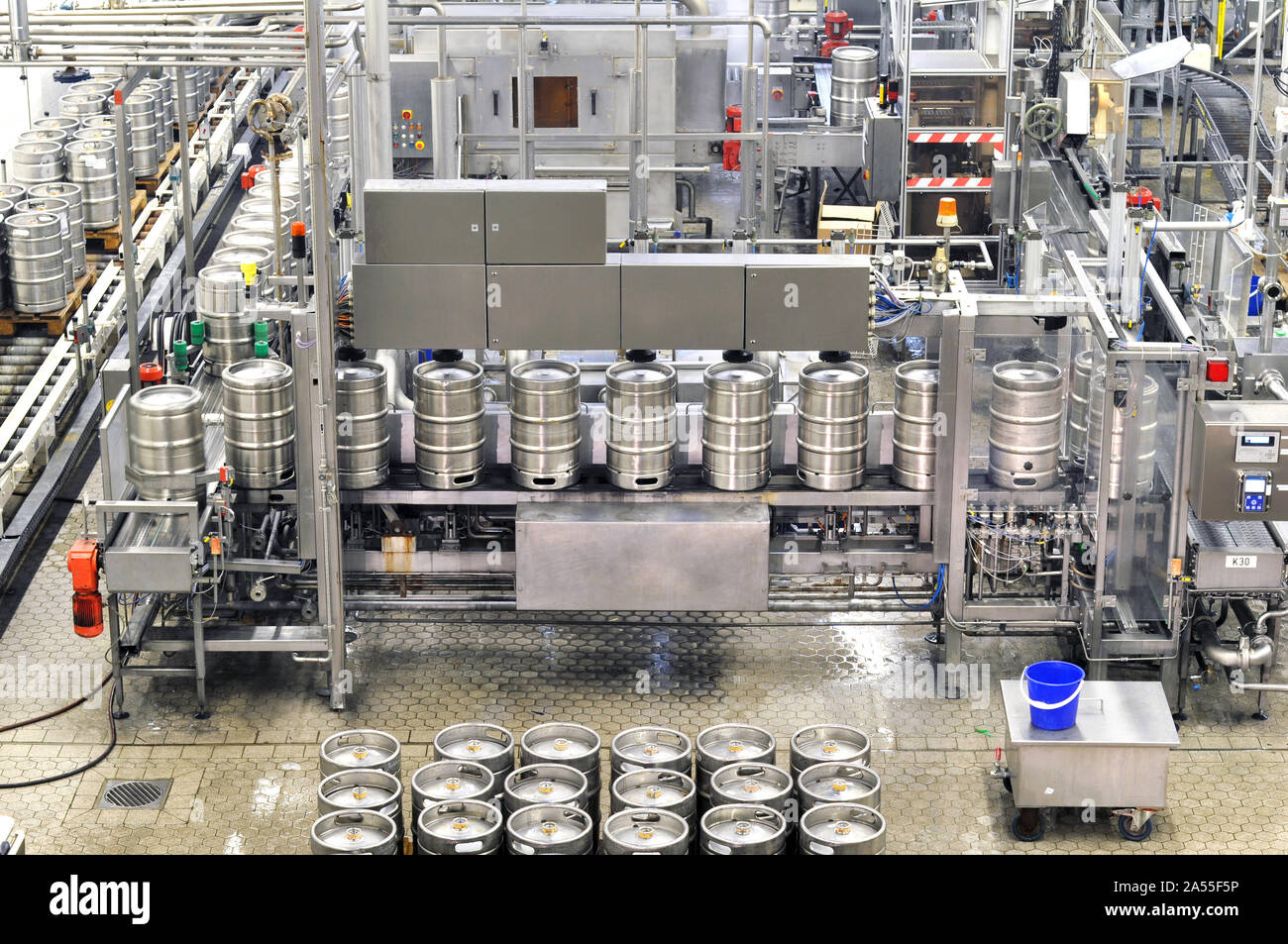beer barrels in the filling process in a brewery beer production in the modern food industry