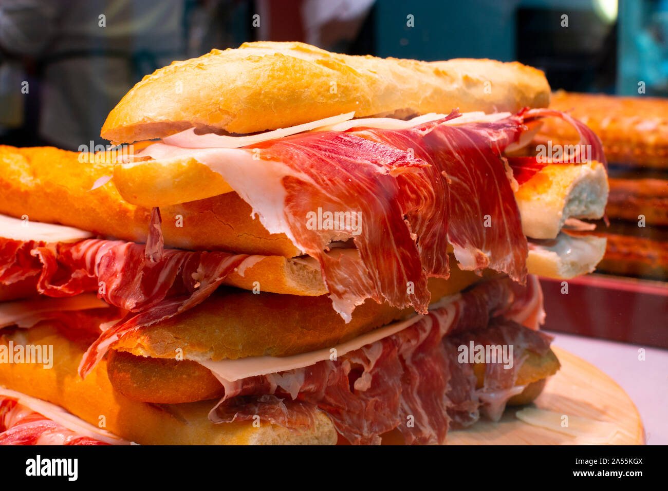 Spanish tapas street food, bocadillo fresh bread with jamon iberico