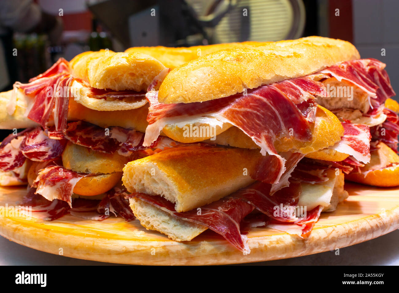 Spanish tapas street food, bocadillo fresh bread with jamon iberico