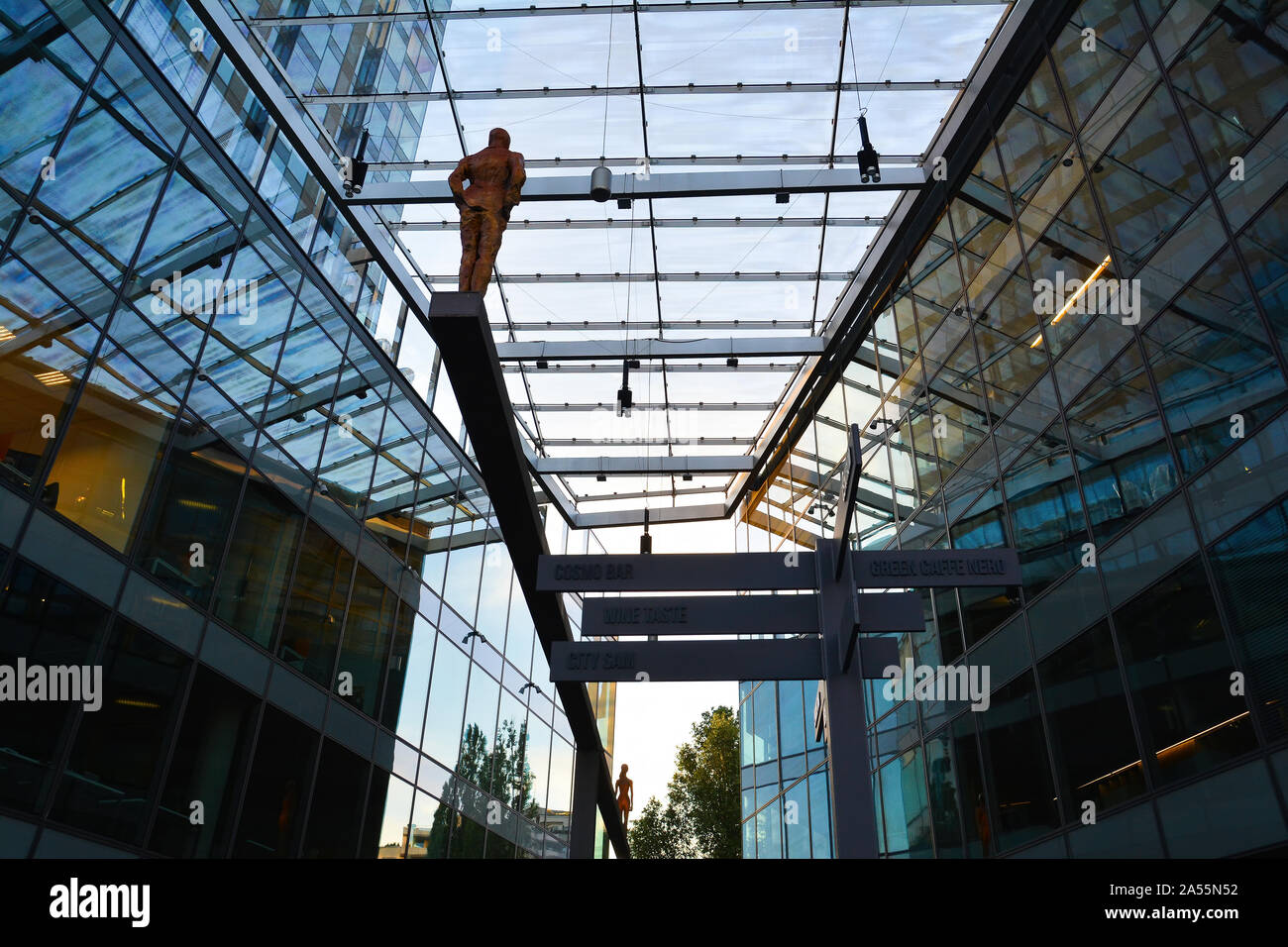 Amazing urban building architecture  and reflection of  the Cosmopolitan Twarda 2/4 center and tower known as Twarda or Hines Tower  in Warsaw, Poland Stock Photo