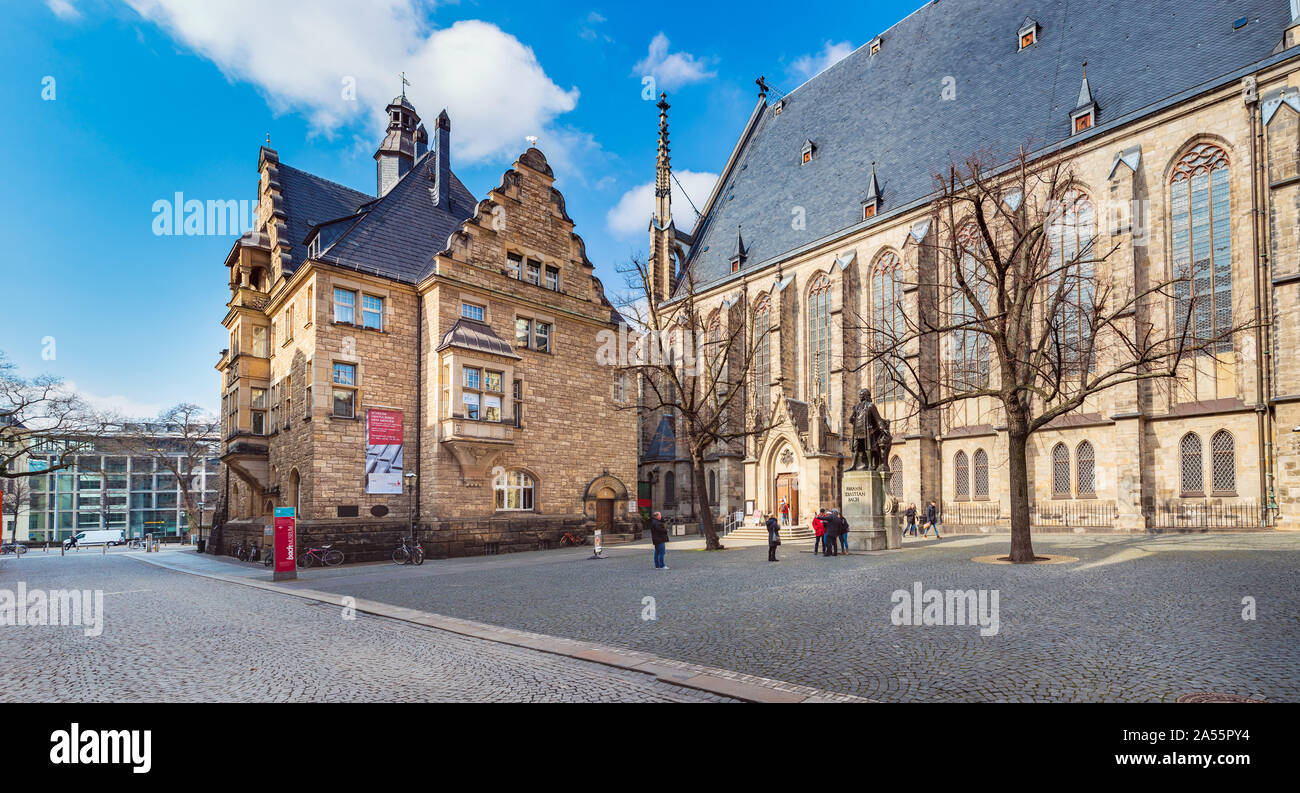 LEIPZIG, GERMANY - CIRCA MARCH, 2018:  The Thomaskirche alsias the St. Thomas Church with Johann Sebastian Bach monument in Leipzig, Germany Stock Photo