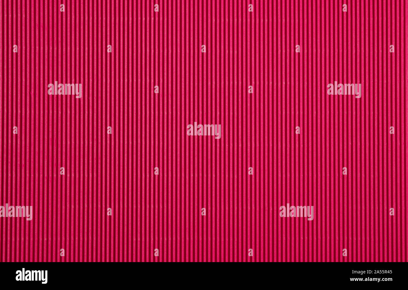 Corrugated cardboard paper magenta color background and texture, copy space. Stock Photo
