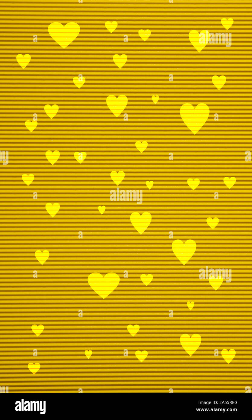 Love concept. Yellow color corrugated cardboard paper and hearts background and texture Stock Photo