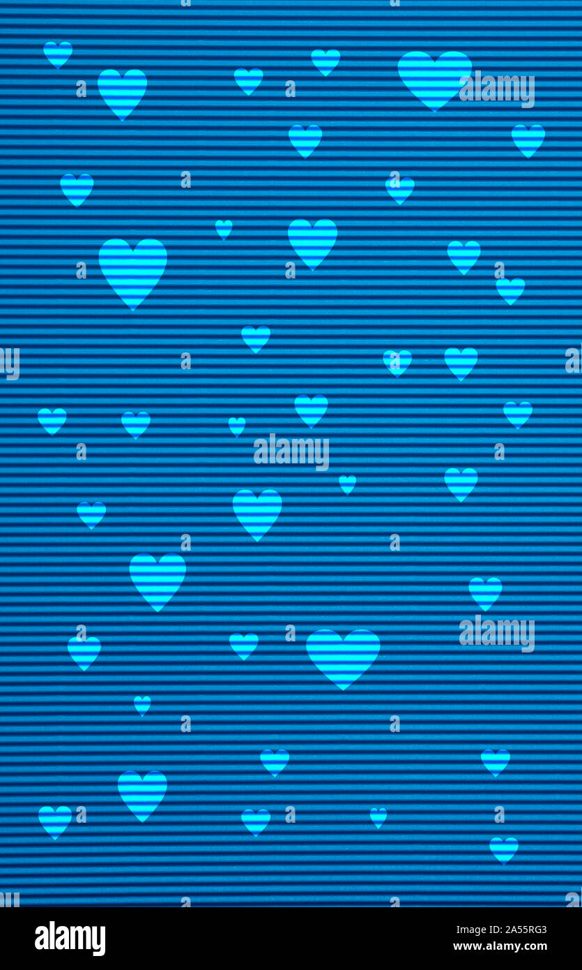 Love concept. Blue color corrugated cardboard paper and hearts background and texture Stock Photo